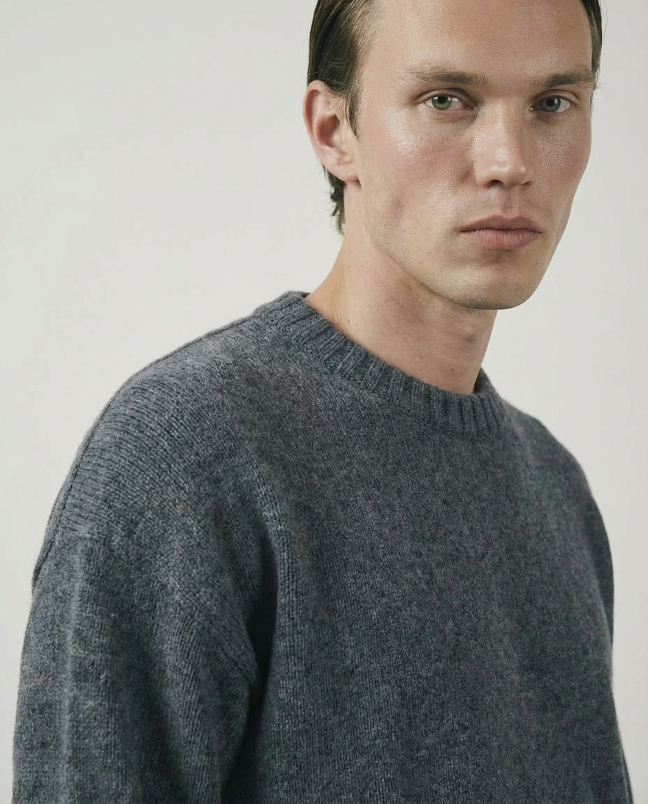 woman wearing a dark gray charcoal crewneck sweater made in italy casa nodale merino wool and cashmere